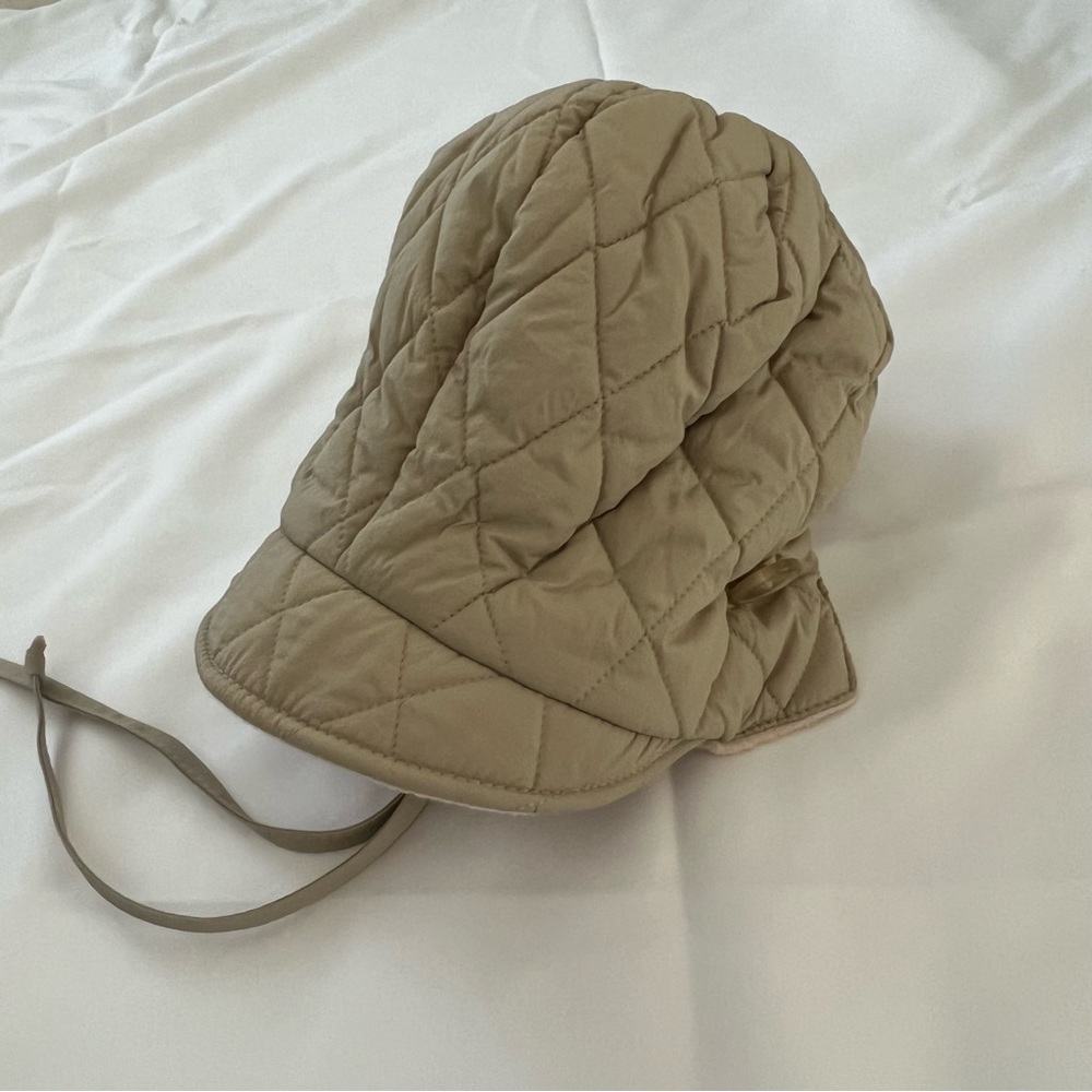 beige quilted hat bonnet with button drawstrings detail